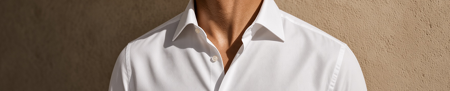 Close-up of an exceptional white shirt showing collar, buttons, weave and fit